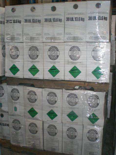 Pallet of 30 lb refrigerant boxes wrapped in plastic, labeled for EPA-certified technicians or resale use