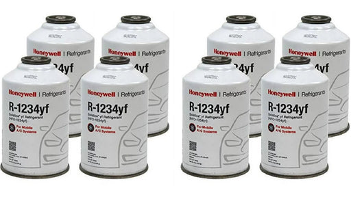 Eight cans of Honeywell R-1234yf Solstice® refrigerant for mobile A/C systems, arranged in two rows.