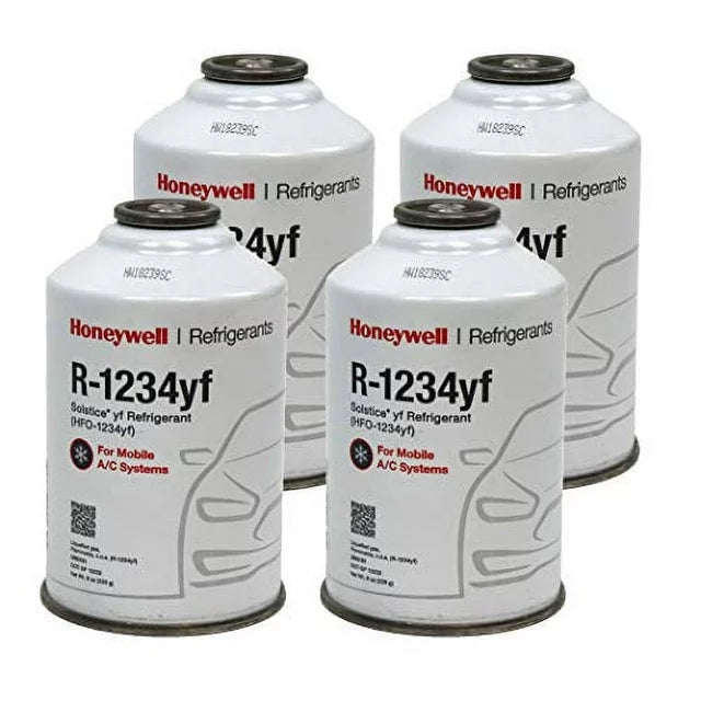 Four cans of Honeywell R-1234yf refrigerant designed for mobile air conditioning systems.